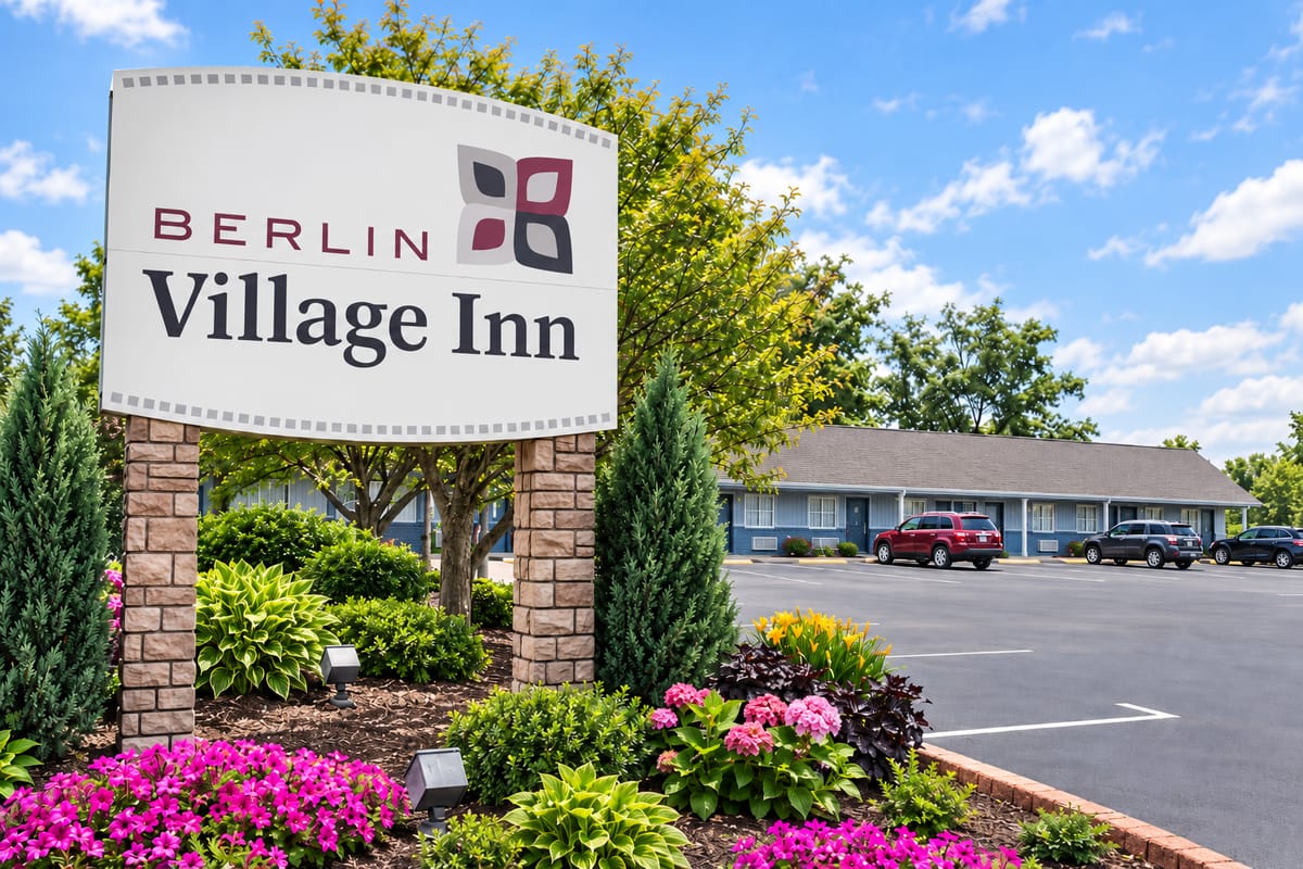Berlin Village Inn sign and flower beds in front of the inn on State Route 39 in Berlin, Ohio
